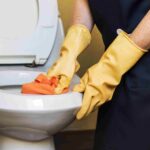 housekeeper-cleaning-hotel-room