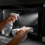 micro oven while cleaning with hand and spary